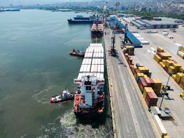 istock Tugboat accompanies the container ship when entering the intarnational port. 1549060078