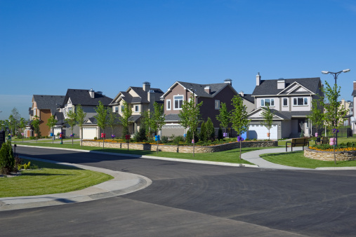 Image of Landscaping on middleclass homes aerial neighborhood fresh cut lawns