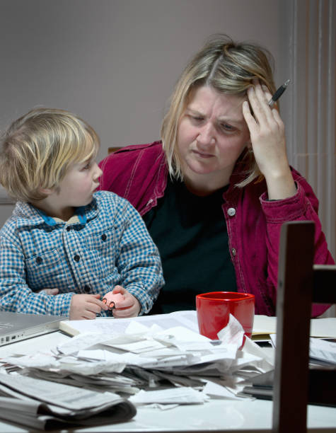 istock Stressed and tired mother dealing with financial issues 154906287