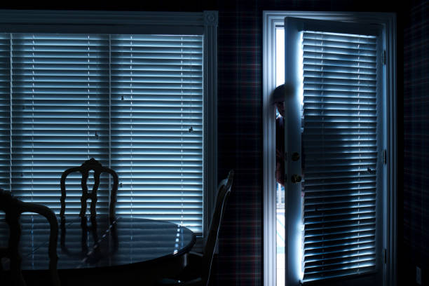 istock Burglar Breaking In To Home At Night Through Back Door 154906339