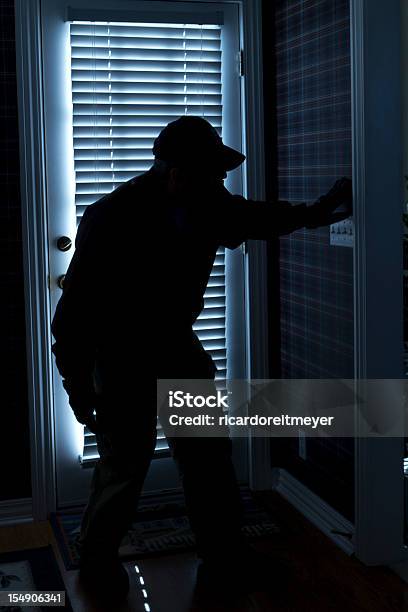 Shadow Of Man In The Dark Right Next To The Front Door Stock Photo - Download Image Now