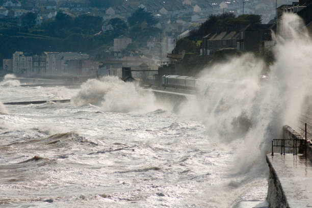 istock Storm at Dawlish waves breaking over train 154906442