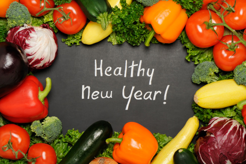 Healthy new year resolution concept  with blackboard and vegetables. More vegetables...