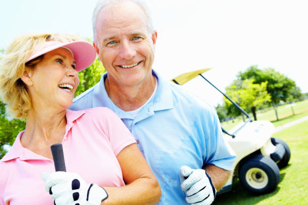 istock Senior couple smiling, ready to play golf 154906632