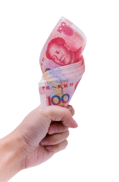 istock Holding Chinese Yuan Note (clipping path) isolated on white background 154907422