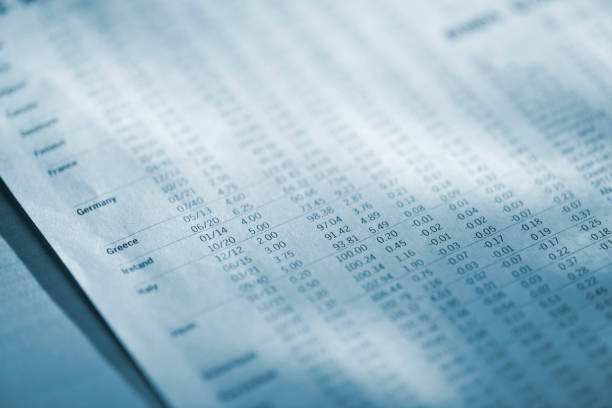 istock blue toned image of financial newspaper 154907434