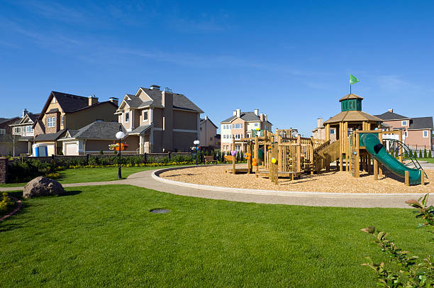 Several suburban houses with wooden playground  swing play equipment photos stock pictures, royalty-free photos & images