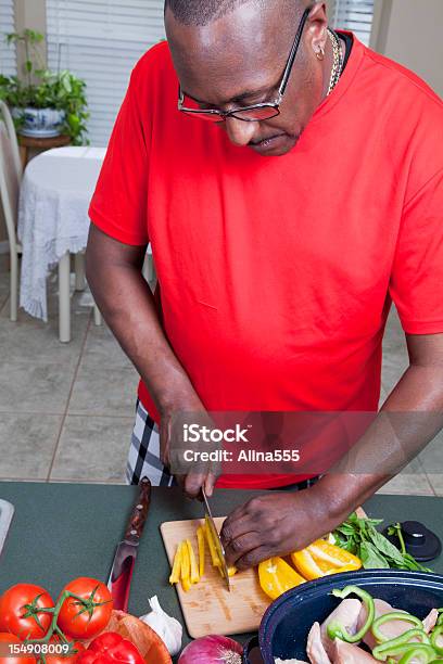 African American Man Cooking In The Home Kitchen Stock Photo - Download Image Now - 40-49 Years, Adult, Adults Only