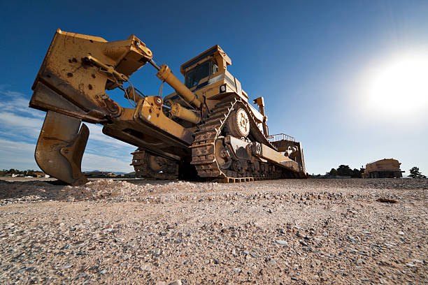 Heavy Equipment Bulldozer with Plow  large machine stock pictures, royalty-free photos & images