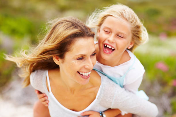 istock Daughter enjoying piggyback ride 154908585