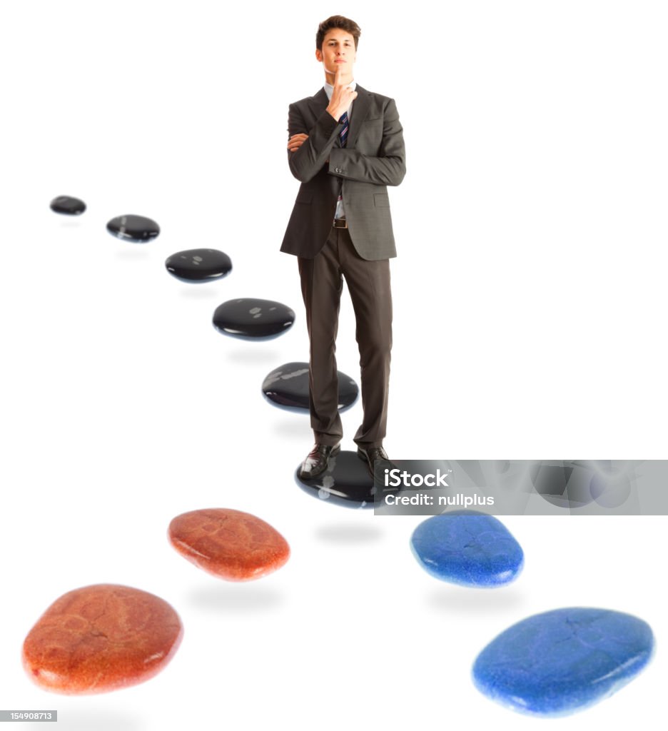 making a decision businessman standing at a crossroads, pondering which way to take next. Stepping Stone Stock Photo