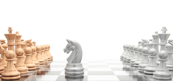 Close-up high-angle view of chess board on wooden vintage floor in dark room, selective focus, closeup. Business strategy concept.