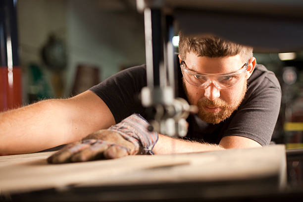 Man Using a Bandsaw stock photo