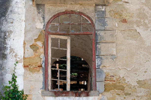 istock Broken window of an abandoned building 1549123077