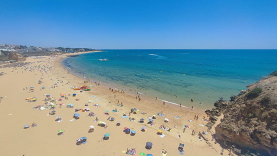 Fisherman`s beach in Albufeira, Portugal in summer of 2023, aerial view