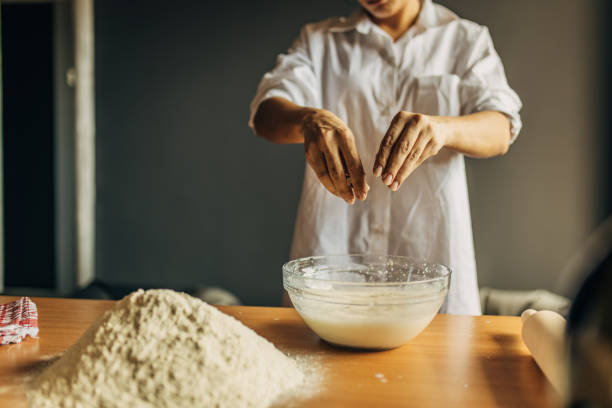istock A young woman preparing dough 1549153104