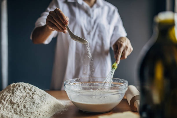 istock A young woman preparing dough 1549157330