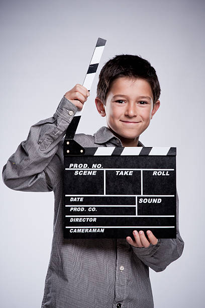 istock Child with movie clapper board. 154917337