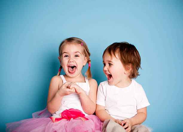So FUNNY! Girl and Boy Laughing Hysterically  brother photos stock pictures, royalty-free photos & images