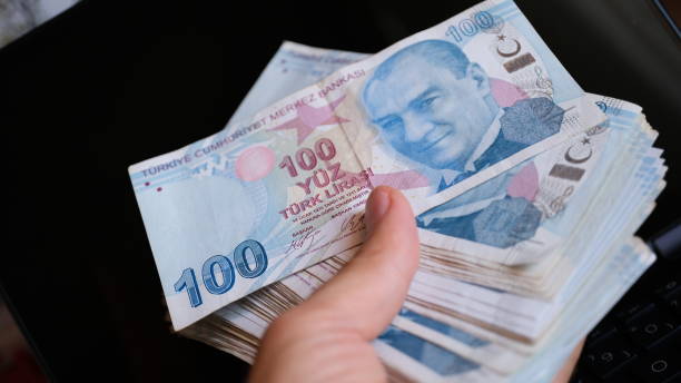 istock Lots of 100 Turkish Liras together close-up 1549176830