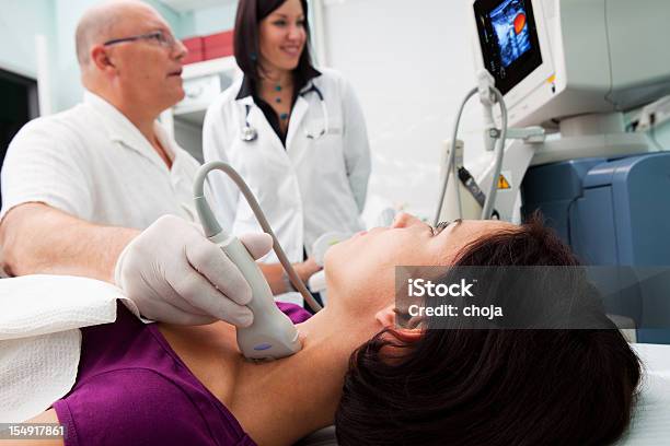 Doctor Is Giving Beautiful Young Patient An Ultra Sound Stock Photo - Download Image Now