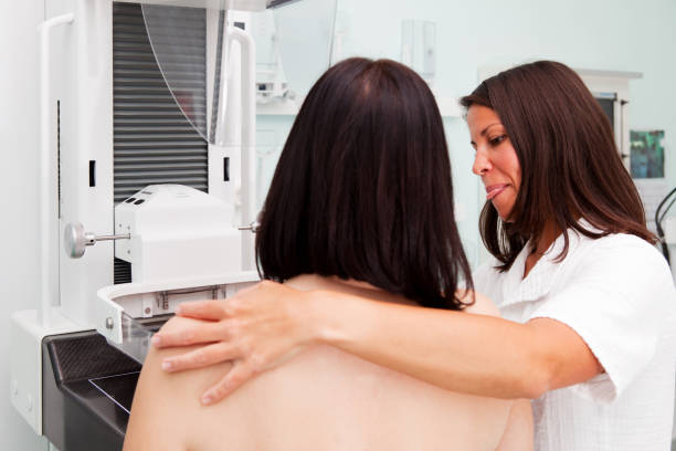 istock Nurse with young women having a mammogram 154917868