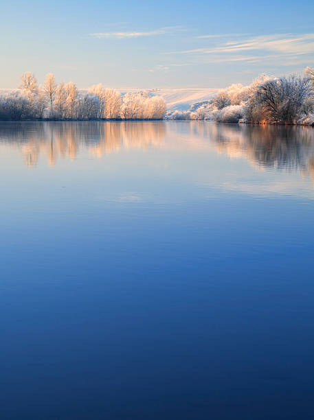 istock Winter Morning, Frost Covered Trees and Landscape Along River 154917876