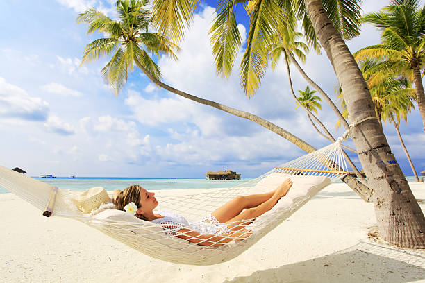 istock Young woman resting in a hammock. 154917984