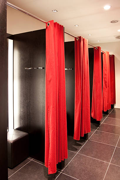 Fitting rooms with red curtains stock photo