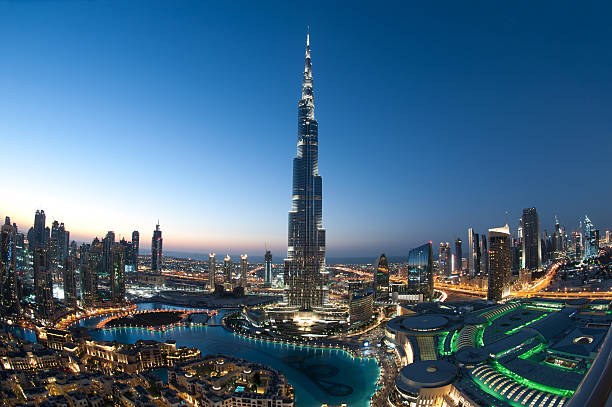 City of Dubai Burj Khalifa gorgeous image of dubai cityscape after sunset, please also check the other brilliant collections below. united arab emirates stock pictures, royalty-free photos & images