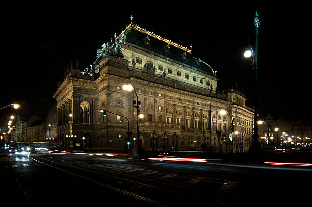 Old town at night with motion blur traffic, intersection, Prague