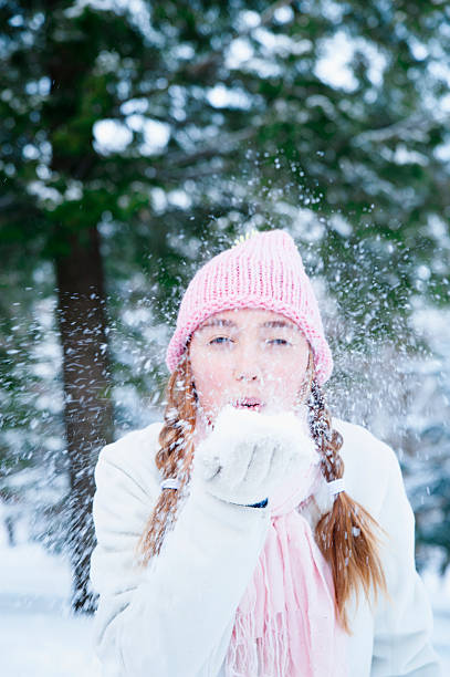 istock Young girl blowing snow. 154918432