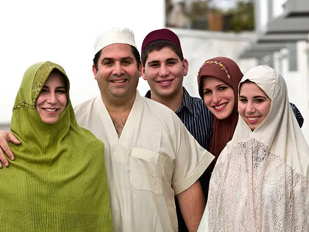 Middle eastern Parents posing with their three children (this picture has been taken with a Hasselblad H3D II 31 megapixels camera)