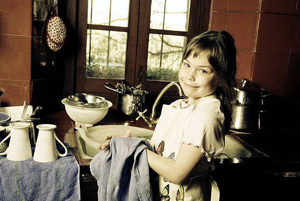Young girl helping wuth home chores.
