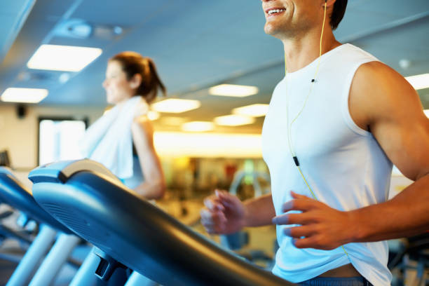istock Man enjoying his run on treadmill 154918849