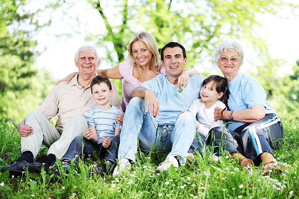 istock People are spending wonderful day at the park. 154918896