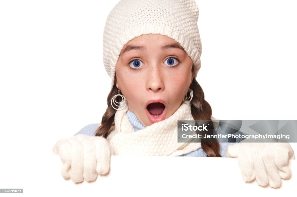 Winter Girl with a Blank Sign  10-11 Years Stock Photo