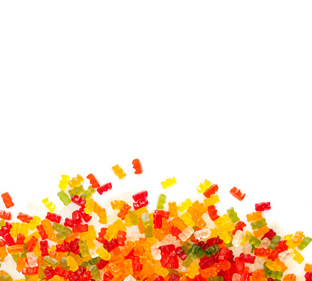 gummibears on white background. Assortment of colorful fruity Gummy Bears isolated on white background