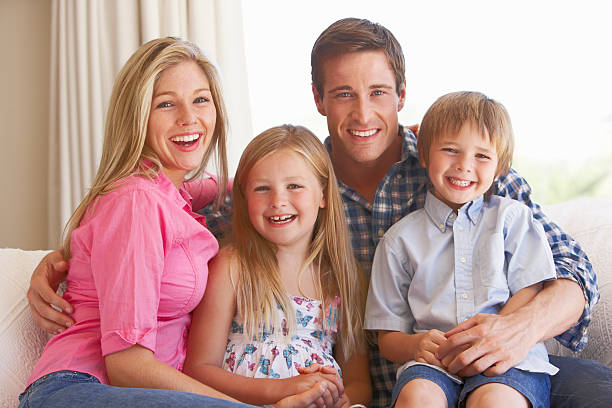 istock Family Relaxing On Sofa At Home 154919456