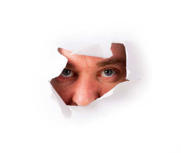 istock Man staring from hole on white paper 154919935