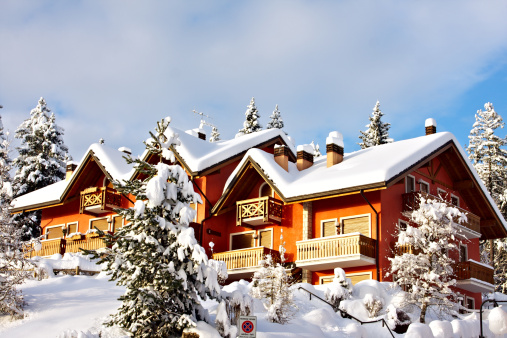 A relaxing winter landscape on Asiago plateau after an heavy snowfall with beautifull holiday houses