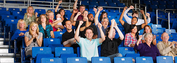 istock A picture of a crowd sitting in benches cheering 154920440