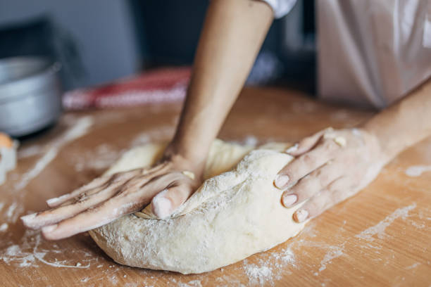 istock Woman preparing dough 1549205744