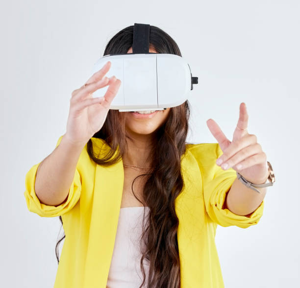 istock Vr, metaverse and woman with 3d glasses in studio isolated on a white background. Virtual reality, futuristic and person with digital technology for fantasy, gaming and cyber experience on internet. 1549219755