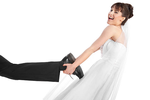 Newly wed couple,, bride caught the groom by the ankle and dragging