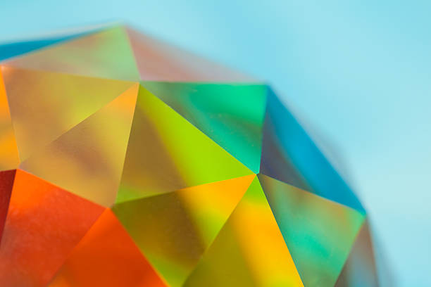 Prismatic Faceted Crystal Sphere, Color Spectrum Crystal sphere refracting a riot of colors. A spherical prism. The object is clear glass; natural prismatic coloring. geodesic dome stock pictures, royalty-free photos & images