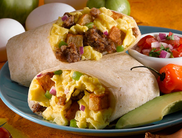 Egg Burrito An up-close view of a egg burrito burrito stock pictures, royalty-free photos & images