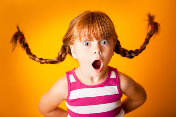 Shocked, Red-Haired Girl with Look of Surprise stock photo