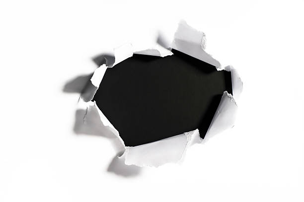 shredded paper with a hole stock photo
