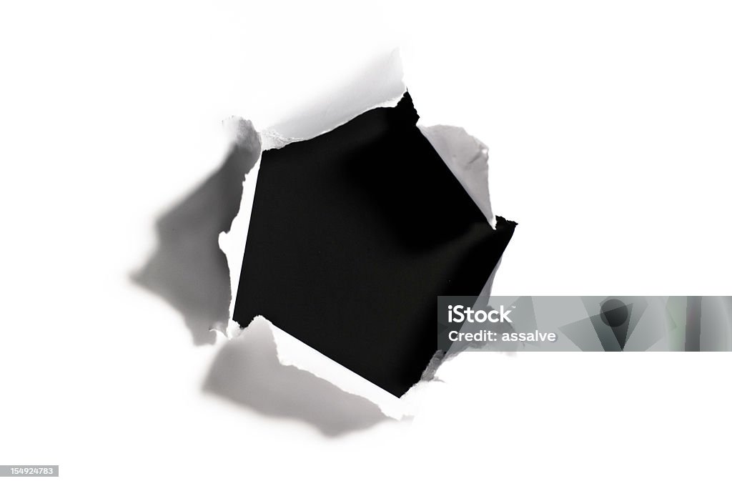 Black hole in torn white paper look in and discover what's behind. See here more torn paper images: Paper Stock Photo